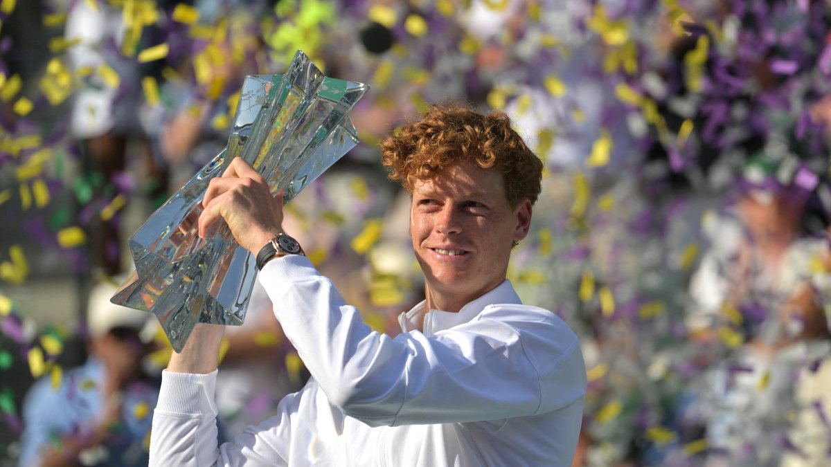 Italy's Jannik Sinner celebrates with the championship trophy after defeating Russia's Daniil Medvedev in the men’s final of the BNP Paribas Open at the Indian Wells Tennis Garden, Indian Wells, U.S., March 15, 2026. (AFP Photo)
