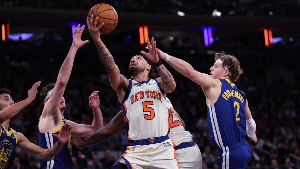 New York Knicks' Jose Alvarado attempts a layup defended by Golden State Warriors' Brandin Podziemski during the fourth quarter at Madison Square Garden, New York City, U.S., March 15, 2026. (AFP Photo)
