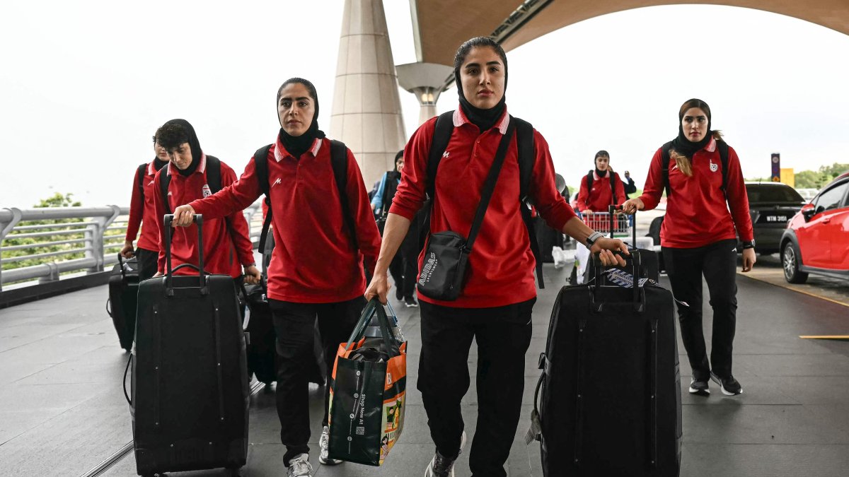 Members of Iran's women's football team arrive at the Kuala Lumpur International Airport, Sepang, Malaysia, March 16, 2026. (AFP Photo)