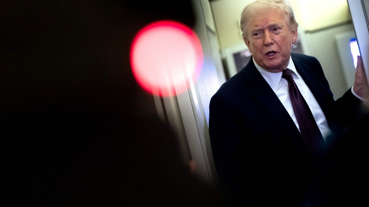 U.S. President Donald Trump speaks to the media onboard Air Force One, March 15, 2026. (AFP Photo)