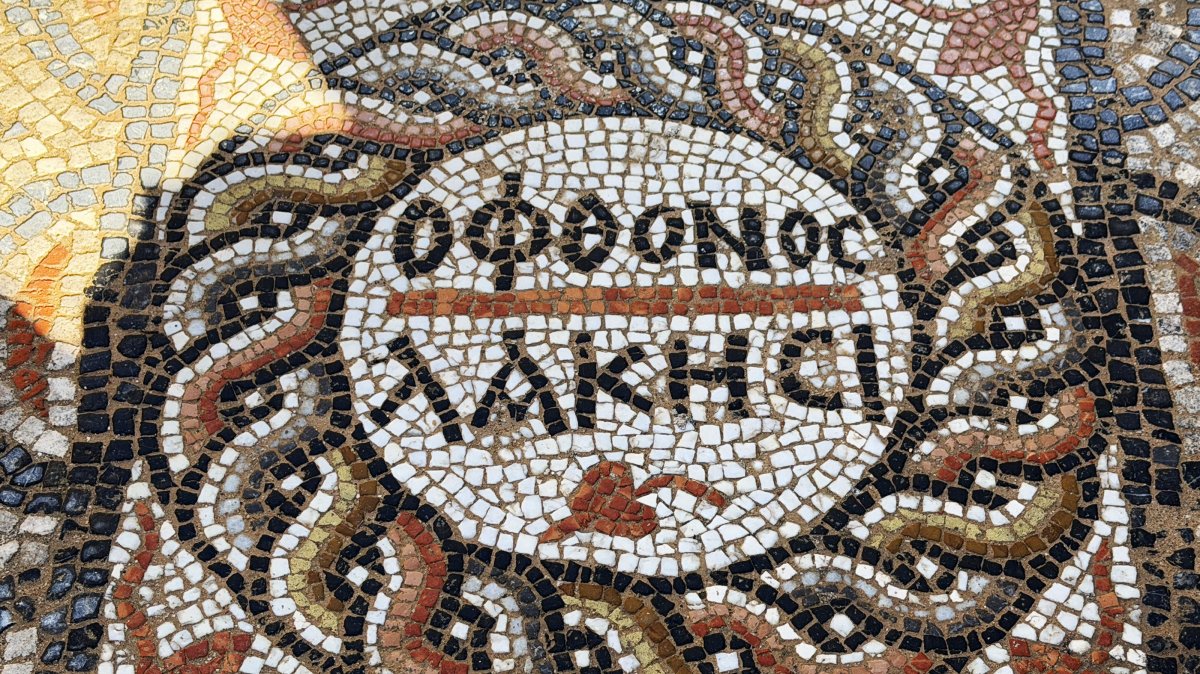 An ancient mosaic with an inscription saying "Let the jealous envy" is seen in Alanya, Antalya, in this photo released on March 16, 2026. (AA Photo)