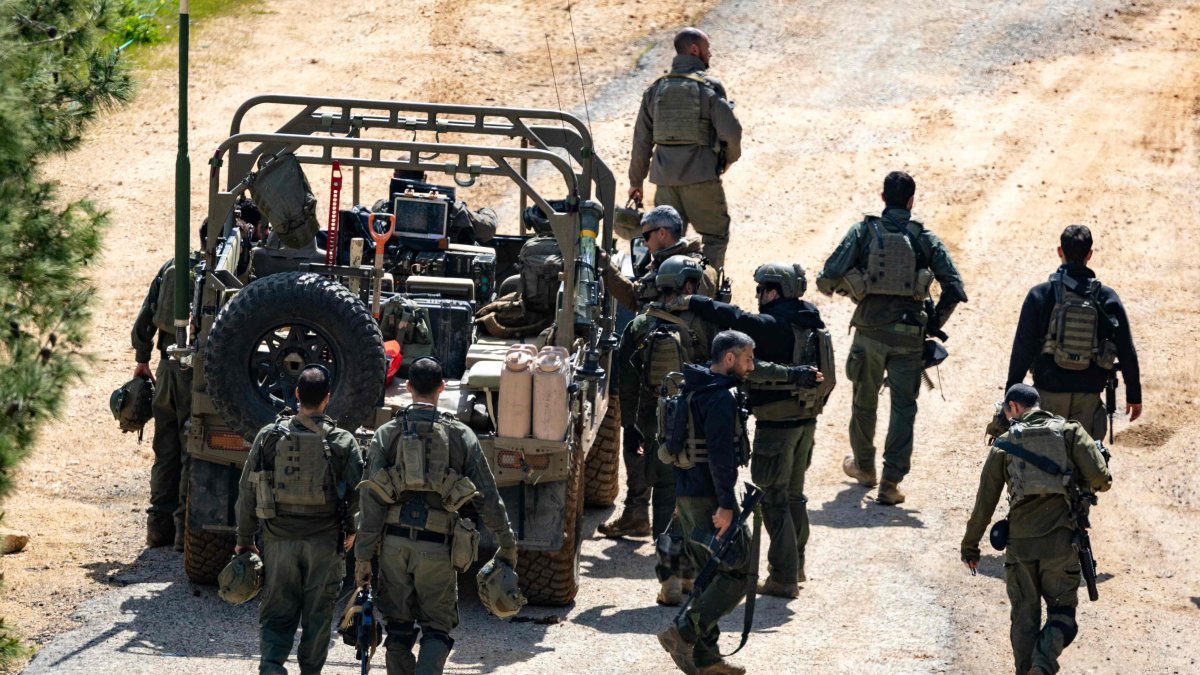 Israeli army soldiers gather on the border with Lebanon in the Upper Galilee, northern Israel on March 16, 2026. (AFP Photo)