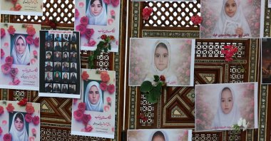 Photos of schoolchildren from the Shajarah Tayyebeh primary school who died in a bombing are displayed at the Iranian Embassy, Tunis, Tunisia, March 12, 2026. (EPA Photo)