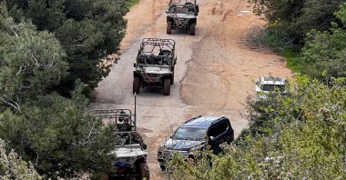Israeli soldiers in military vehicles congregate on the Israeli side of the Israel-Lebanon border, in northern Israel, March 16, 2026. (Reuters Photo)