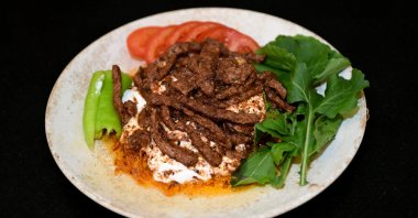 A plate of çökertme kebab, a traditional Turkish dish, is served, Muğla, southwestern Türkiye, Jan. 8, 2026. (AA Photo)