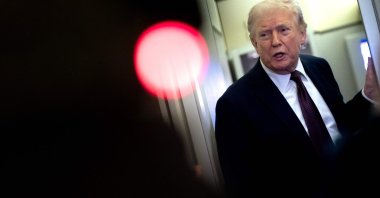 U.S. President Donald Trump speaks to the media onboard Air Force One, March 15, 2026. (AFP Photo)