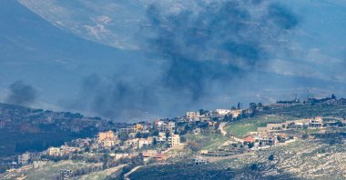 Smoke rises from the Lebanese village of Khiam after an Israeli strike as seen from the Upper Galilee in northern Israel, March 16, 2026. (AFP Photo)