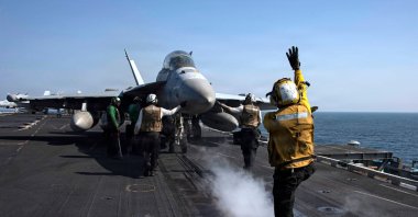 An EA-18G Growler, attached to Electronic Attack Squadron (VAQ) 133, as it prepares to launch from the flight deck of Nimitz-class aircraft carrier USS Abraham Lincoln (CVN 72) in support of Operation Epic Fury, March 7, 2026. (US Navy Handout via AFP)