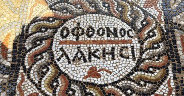 An ancient mosaic with an inscription saying "Let the jealous envy" is seen in Alanya, Antalya, in this photo released on March 16, 2026. (AA Photo)