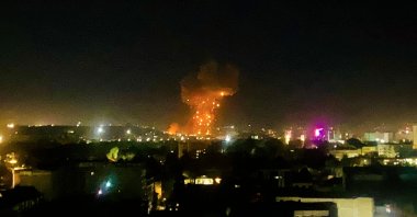 This photograph shows smoke and flames rising from an area hit by airstrikes, in Kabul on March 16, 2026. (AFP Photo)