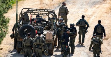Israeli army soldiers gather on the border with Lebanon in the Upper Galilee, northern Israel on March 16, 2026. (AFP Photo)