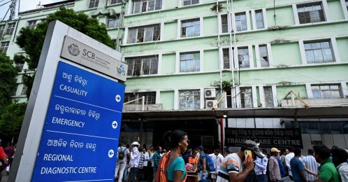 Relatives of fire victims gather outside the trauma care centre at SCB Medical College and Hospital in Cuttack, Odisha, India, March 16, 2026. (AFP Photo)