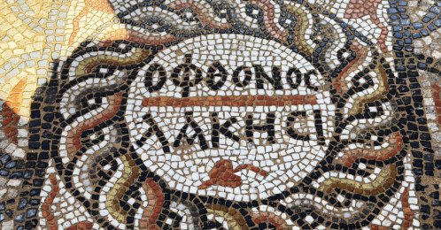 An ancient mosaic with an inscription saying "Let the jealous envy" is seen in Alanya, Antalya, in this photo released on March 16, 2026. (AA Photo)
