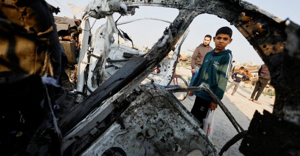 Palestinians inspect the site of an Israeli airstrike targeting a police vehicle in the central Gaza Strip, Palestine, March 15, 2026. (Reuters Photo)