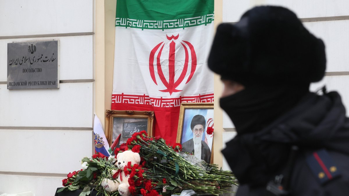 A Russian police officer patrols in front of a makeshift memorial featuring a portrait of the late Iranian Supreme Leader Ayatollah Ali Khamenei near the Iranian Embassy, Moscow, Russia, March 2, 2026. (EPA Photo)