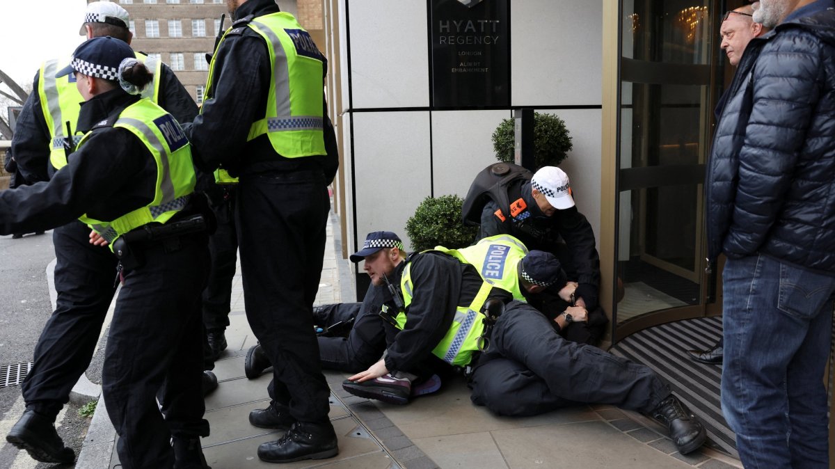 Police detain a person on the day of a static protest to mark Al-Quds Day in support of Palestine, organised by the Islamic Human Rights Commission and a counter-protest, London, U.K., March 15, 2026. (Reuters Photo)