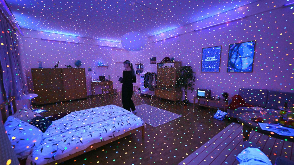 A visitor stands inside the installation "I'm Here, but Nothing" during a preview for an exhibition of Japanese artist Yayoi Kusama at the Museum Ludwig, Cologne, Germany, March 12, 2026. (AFP Photo)