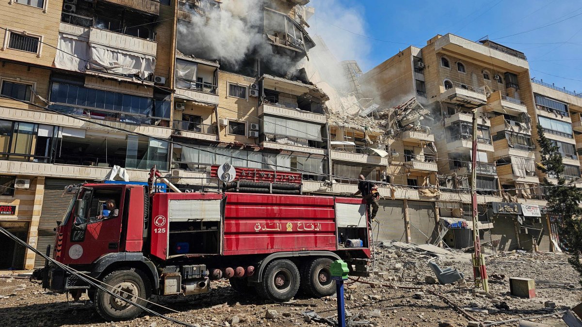 Firefighters work at the site of an Israeli airstrike in the southern suburbs of Beirut, Lebanon, March 17, 2026. (AFP Photo)