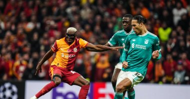 Galatasaray's Victor Osimhen (L) battles Liverpool's Virgil van Dijk during the UEFA Champions League round of 16 first-leg match at RAMS Park, Istanbul, Türkiye, March 10, 2026. (AA Photo)