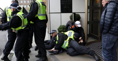 Police detain a person on the day of a static protest to mark Al-Quds Day in support of Palestine, organised by the Islamic Human Rights Commission and a counter-protest, London, U.K., March 15, 2026. (Reuters Photo)