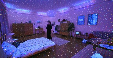 A visitor stands inside the installation "I'm Here, but Nothing" during a preview for an exhibition of Japanese artist Yayoi Kusama at the Museum Ludwig, Cologne, Germany, March 12, 2026. (AFP Photo)