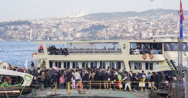 People are seen boarding a ship on a sunny day in Istanbul, Türkiye, Feb. 15, 2026. (AA Photo)