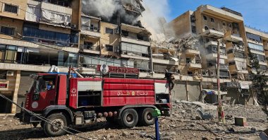 Firefighters work at the site of an Israeli airstrike in the southern suburbs of Beirut, Lebanon, March 17, 2026. (AFP Photo)