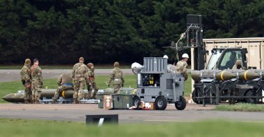 Members of the U.S. Air Force (USAF) prepare munitions at RAF Fairford in south-west England on March 10, 2026. (AFP Photo)