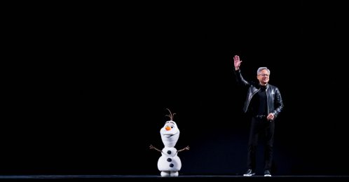 Nvidia CEO Jensen Huang is joined on stage by a Disney animatronic robot during his keynote address at the company's annual GTC developers conference at the SAP Center in San Jose, California, U.S., March 16, 2026. (AFP Photo)