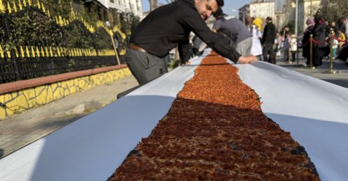The world’s longest lahmacun is displayed at the event, Istanbul, Türkiye, March 17, 2026. (IHA Photo)