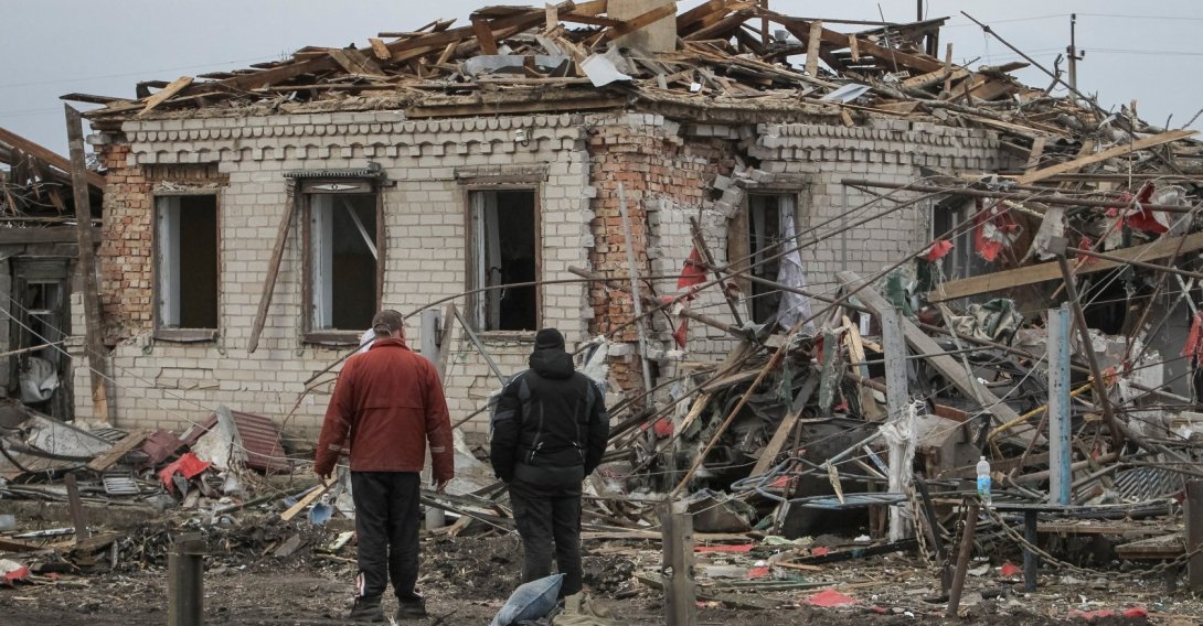 Residents stand at the site of a Russian missile strike, amid Russia's attack on Ukraine, village of Zaitseve, Dnipropetrovsk region, Ukraine, March 16, 2026. (Reuters Photo)