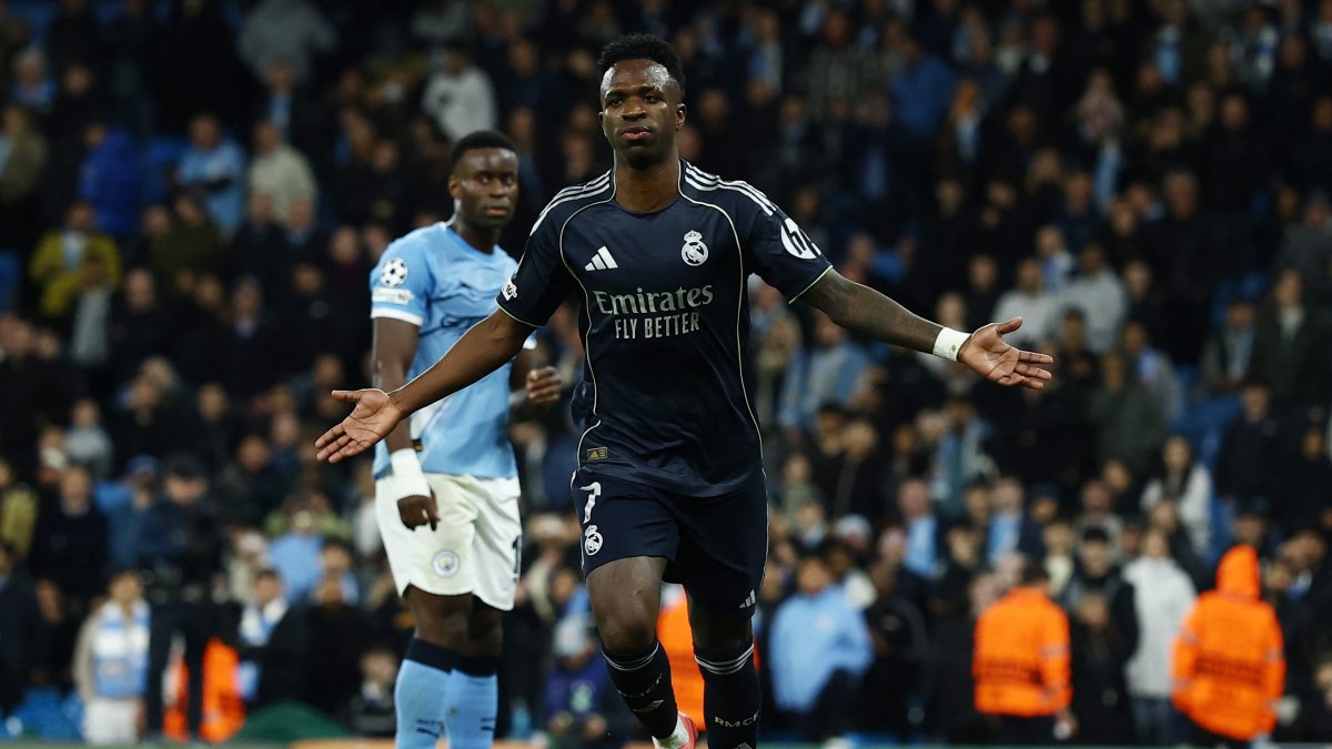 Real Madrid's Vinicius Junior celebrates after scoring the team's second goal during the UEFA Champions League round of 16 second-leg match against Manchester City at Etihad Stadium in Manchester, England, March 17, 2026. (Reuters Photo)