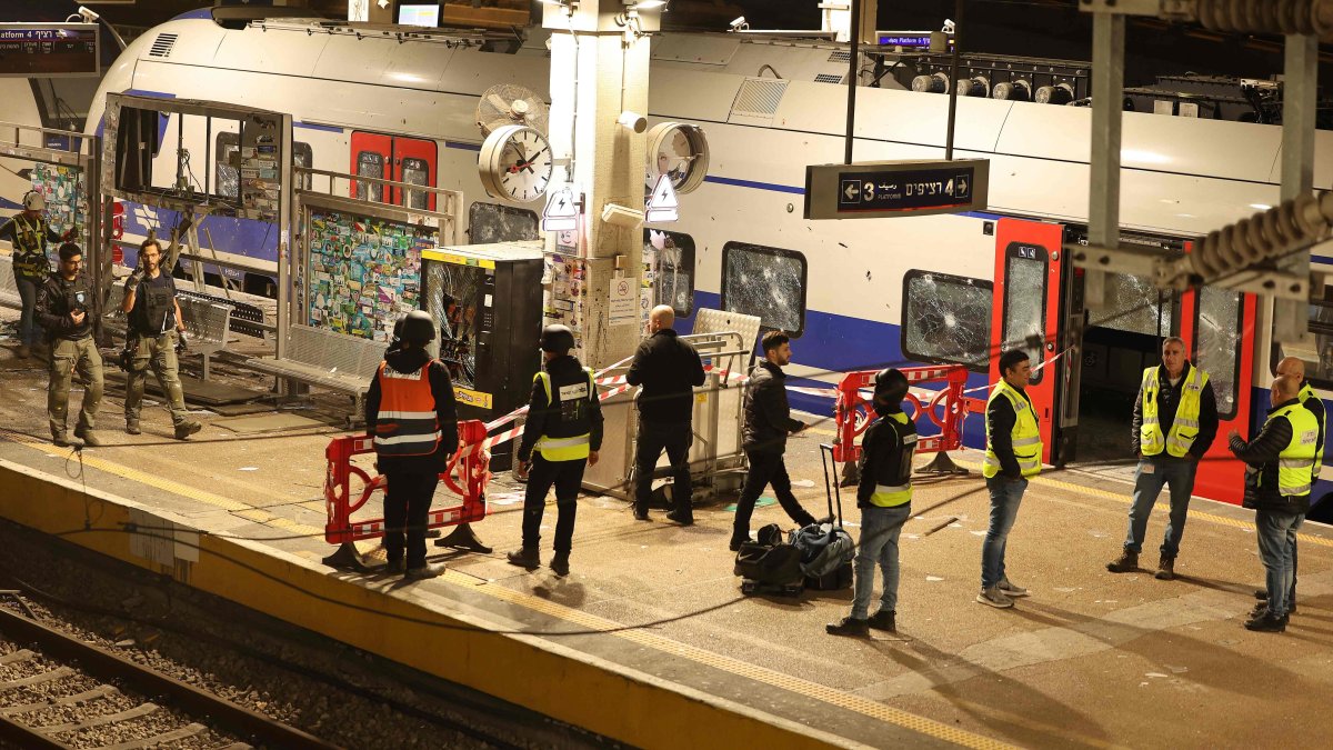 Israeli security forces and rescue workers gather at a train station that was hit by shrapnel after an Iranian strike in Tel Aviv, Israel, March 18, 2026. (AFP Photo)