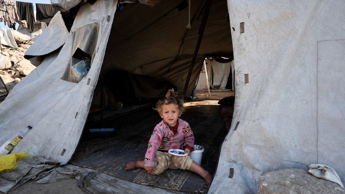 A child sits inside a tent at a tent camp for displaced Palestinians during Israel's two-year genocidal war on Gaza, Deir al-Balah, Gaza, Palestine, March 10, 2026. (Reuters Photo)