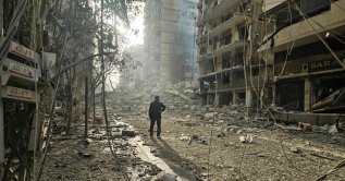 A man looks at the site of overnight Israeli airstrikes in the southern suburbs of Beirut, Lebanon, March 12, 2026. (AFP Photo)