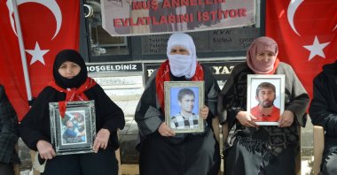 Mothers hold the photos of their children brainwashed by the PKK as they stage a protest, Muş, eastern Türkiye, March 18, 2026. (AA Photo)
