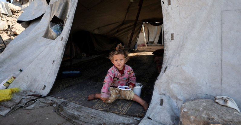 A child sits inside a tent at a tent camp for displaced Palestinians during Israel's two-year genocidal war on Gaza, Deir al-Balah, Gaza, Palestine, March 10, 2026. (Reuters Photo)