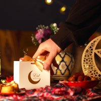 A festive Eid table adorned with treats and wrapped gifts. (Shutterstock Photo)