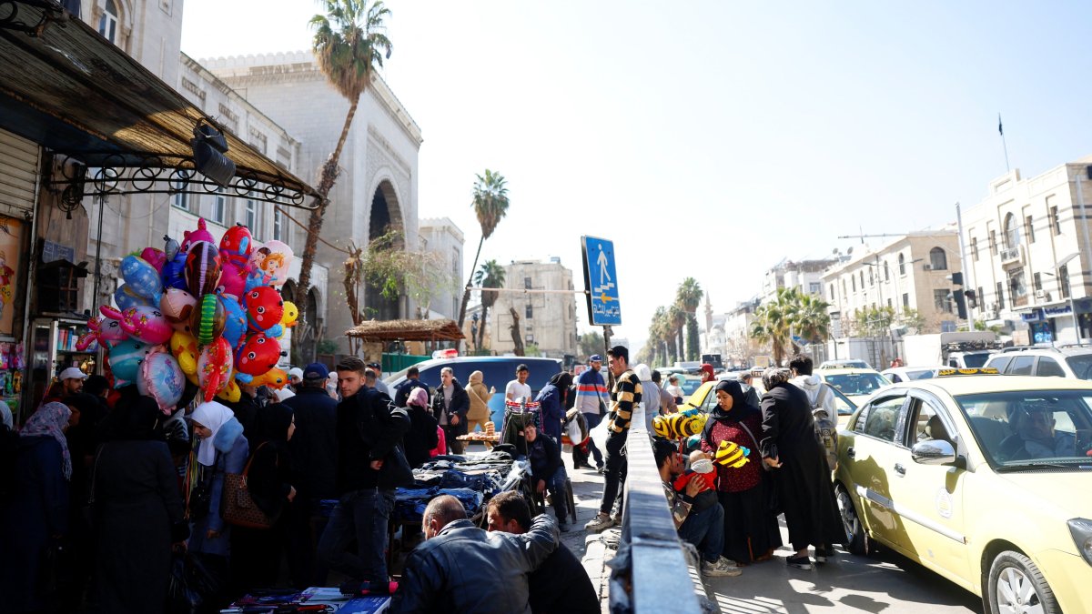 People buy clothes in preparation for Eid al-Fitr, in a market, Damascus, Syria, March 17, 2026. (Reuters Photo)
