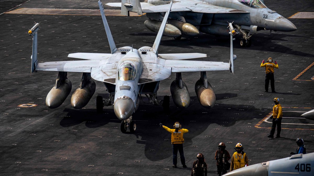 F/A-18E Super Hornets are seen on the flight deck of the USS Gerald R. Ford, March 15, 2026. (AFP Photo)