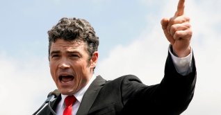 Joe Kent delivers a speech in Washington, U.S., Sept. 18, 2021. (Reuters File Photo)