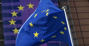 A European Union flag fluttering outside the European Commission headquarters in Brussels, Belgium, March 18, 2026. (AFP Photo)