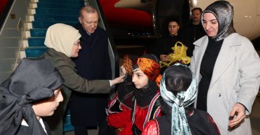 President Recep Tayyip Erdoğan and first lady Emine Erdoğan are welcomed by children as they arrive in Rize, Erdoğan's hometown, to spend Eid al-Fitr, Rize, Türkiye, March 18, 2026. (AA Photo)