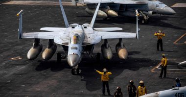 F/A-18E Super Hornets are seen on the flight deck of the USS Gerald R. Ford, March 15, 2026. (AFP Photo)