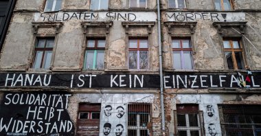 The words "Hanau ist kein Einzelfall" (Hanau is not an isolated event) are painted on the facade of a squatted building in Berlin, Germany, Feb. 22, 2022. (AFP File Photo)