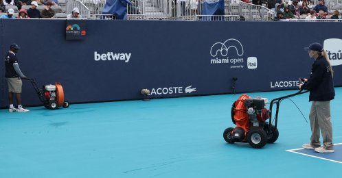 Workers dry Butch Buchholz Court during a rain delay on day 2 of the 2026 Miami Open at Hard Rock Stadium in Miami Gardens, U.S., March 18, 2026. (Reuters Photo)