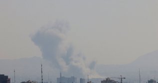 A plume of smoke rises from the site of a strike in Tehran, Iran, March 17, 2026. (AFP Photo)