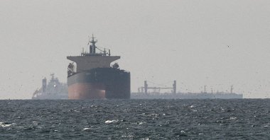 Cargo ships in the Gulf, near the Strait of Hormuz, as seen from northern Ras al-Khaimah, near the border with Oman’s Musandam governance, amid the U.S.-Israeli conflict with Iran, in United Arab Emirates, March 11, 2026. (Reuters Photo)
