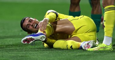 Al Nassr's Cristiano Ronaldo reacts after sustaining an injury during the Saudi Pro League match against Al Najma at King Abdullah Sport City Stadium, Jeddah, Saudi Arabia, Feb. 25, 2026. (AFP Photo)