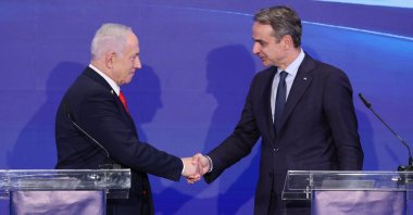 Israeli Prime Minister Benjamin Netanyahu (L) and Greek Prime Minister Kyriakos Mitsotakis shake hands during a joint press conference with Greek Cypriot leader Nikos Christodoulides, after a trilateral meeting at the Citadel of David Hotel in Jerusalem, Dec. 22, 2025. (AP Photo)